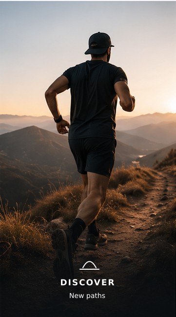 A hiker walking a mountain trail at first light
